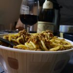 A bowl of Instant Pot Ragu enjoyed in a tent, hiding from the rain!