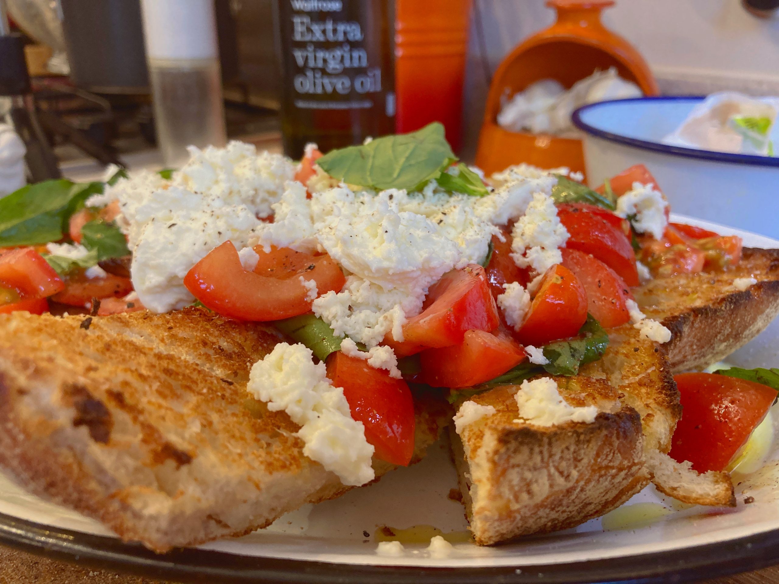 Tomato and mozarella bruschetta served with fresh basil