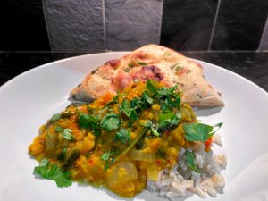 Tarka Dhal served with rice and naan bread