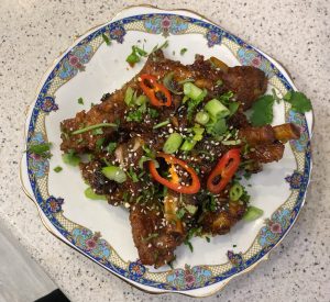 Instant Pot ribs: garlic, ginger & soy glaze topped with chopped chilli, spring onion and coriander
