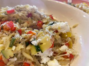 Courgette orzo served with crumbled feta and a sprinkle of parmesan.