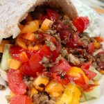 Minced steak kebabs in wholemeal pita with sriracha sauce